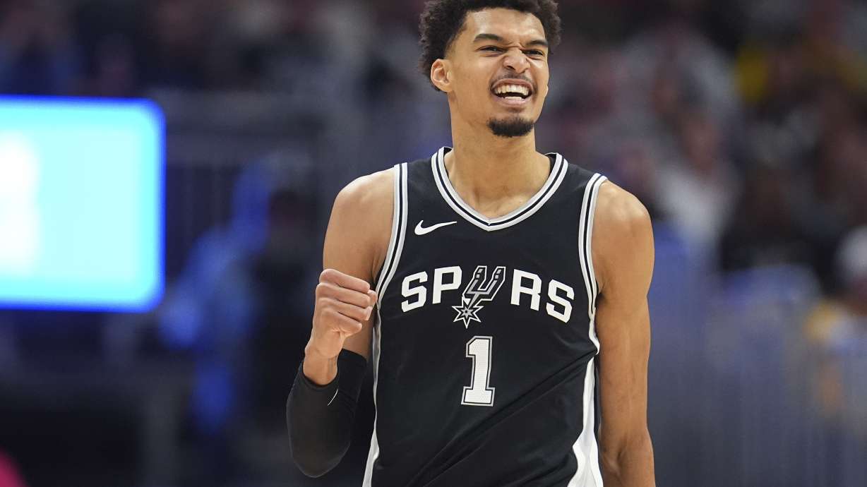 San Antonio Spurs center Victor Wembanyama gestures to the bench after hitting a basket against the Denver Nuggets in the first half of an NBA basketball game Friday, Jan. 3, 2025, in Denver.
