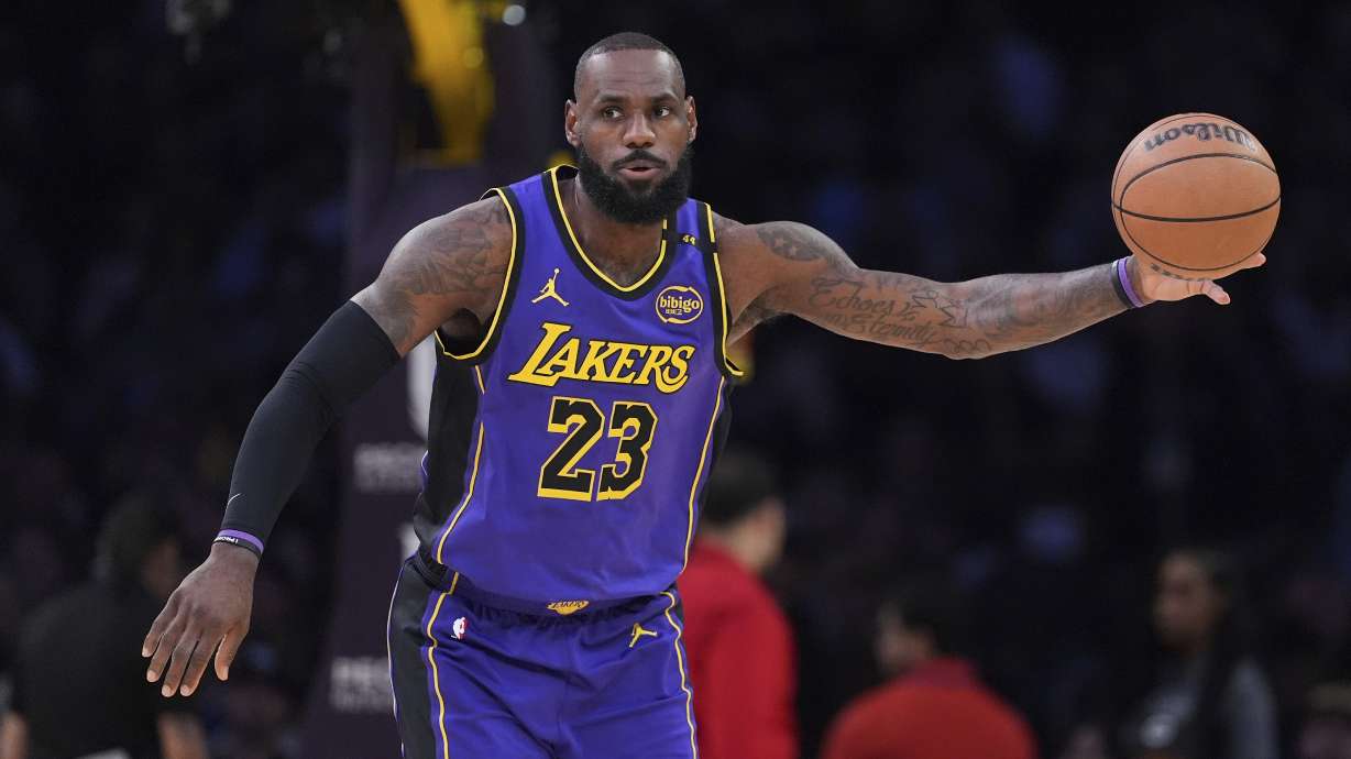 Los Angeles Lakers forward LeBron James takes a pass during the first half of an NBA basketball game against the Atlanta Hawks, Friday, Jan. 3, 2025, in Los Angeles.