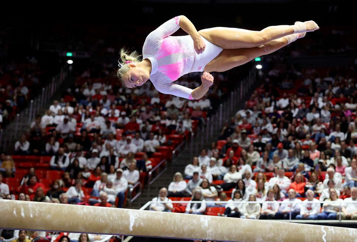Utah Red Rocks’ Camie Winger scores a 9.950 on the beam during a gymnastics meet against Utah State University at the Huntsman Center in Salt Lake City on Friday, Jan. 3, 2025. The University of Utah won.
