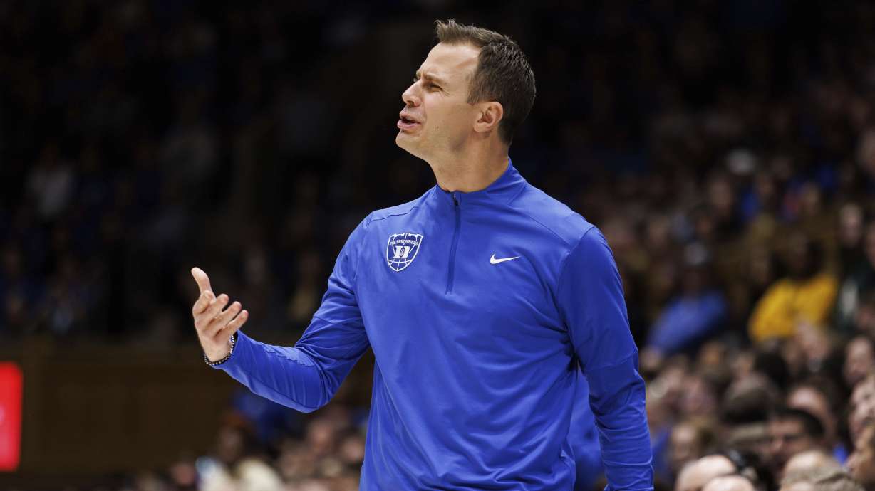 Duke head coach Jon Scheyer reacts to a play during the first half of an NCAA college basketball game against Virginia Tech in Durham, N.C., Tuesday, Dec. 31, 2024.