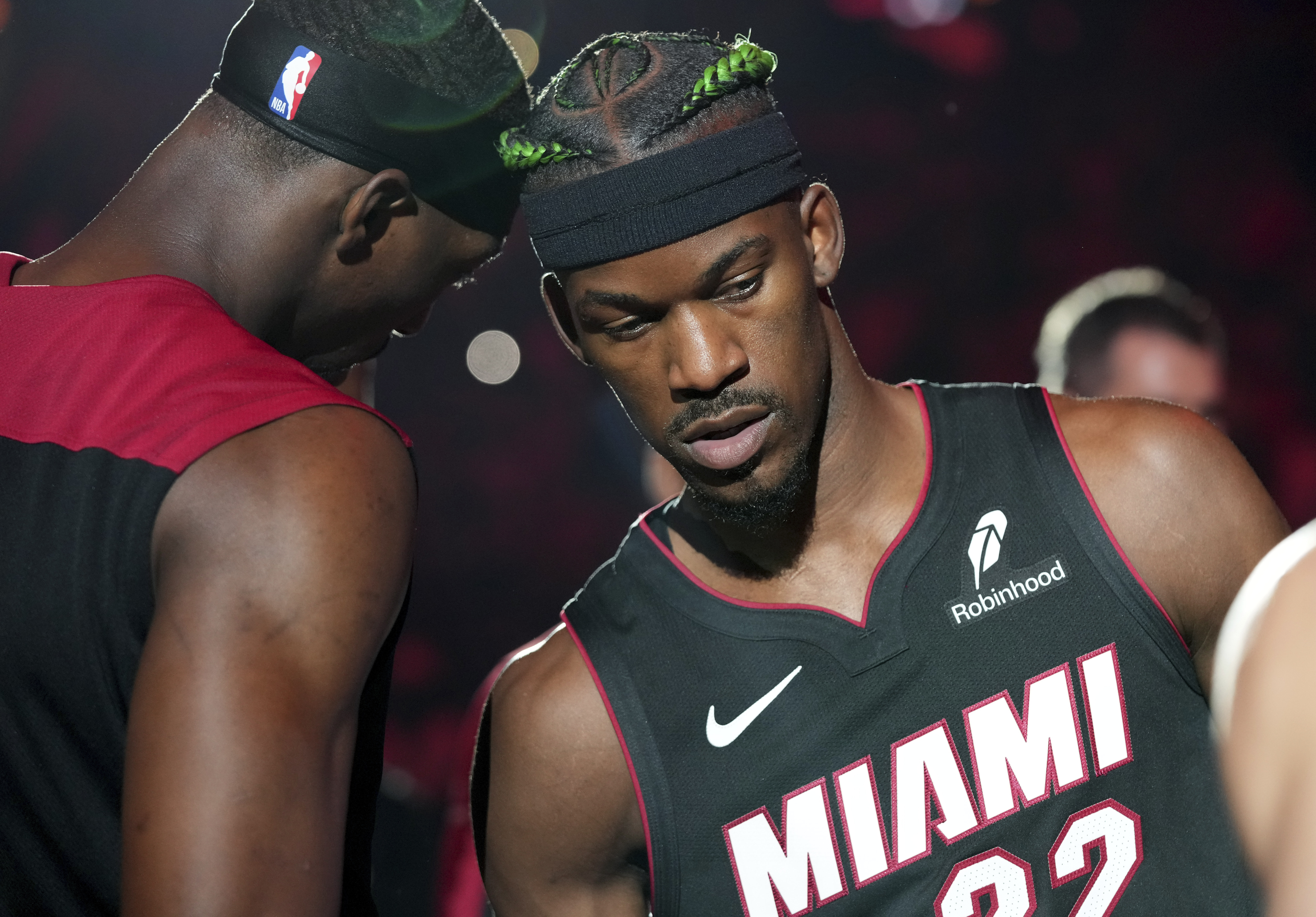 Miami Heat forward Jimmy Butler (22) and center Bam Adebayo, left, are introduced before an NBA basketball game against the Indiana Pacers Thursday, Jan. 2, 2025, in Miami.