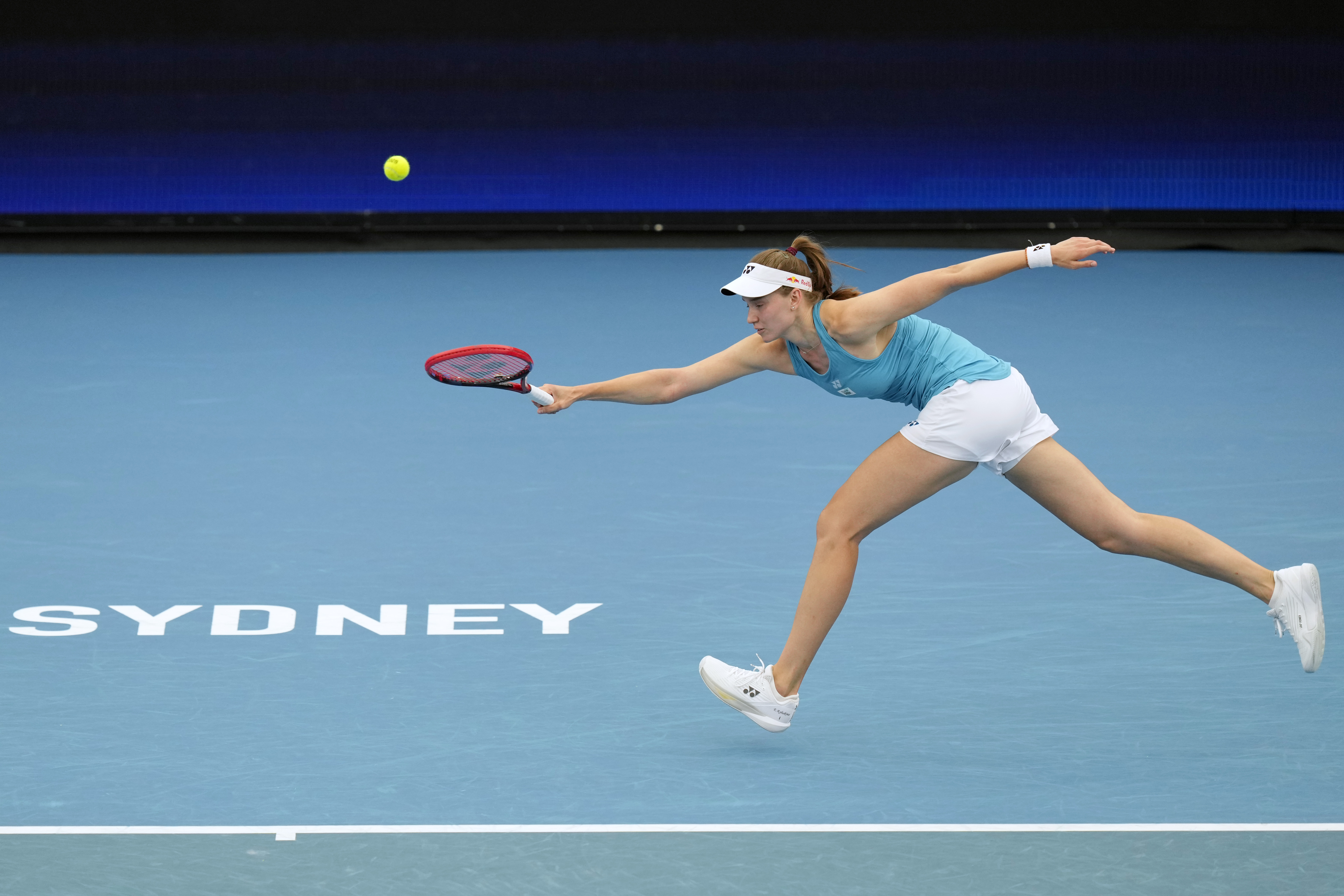 Kazakhstan's Elena Rybakina plays a forehand to Poland's Iga Swiatek during their semifinal match at the United Cup tennis tournament in Sydney, Australia, Saturday, Jan. 4, 2025.