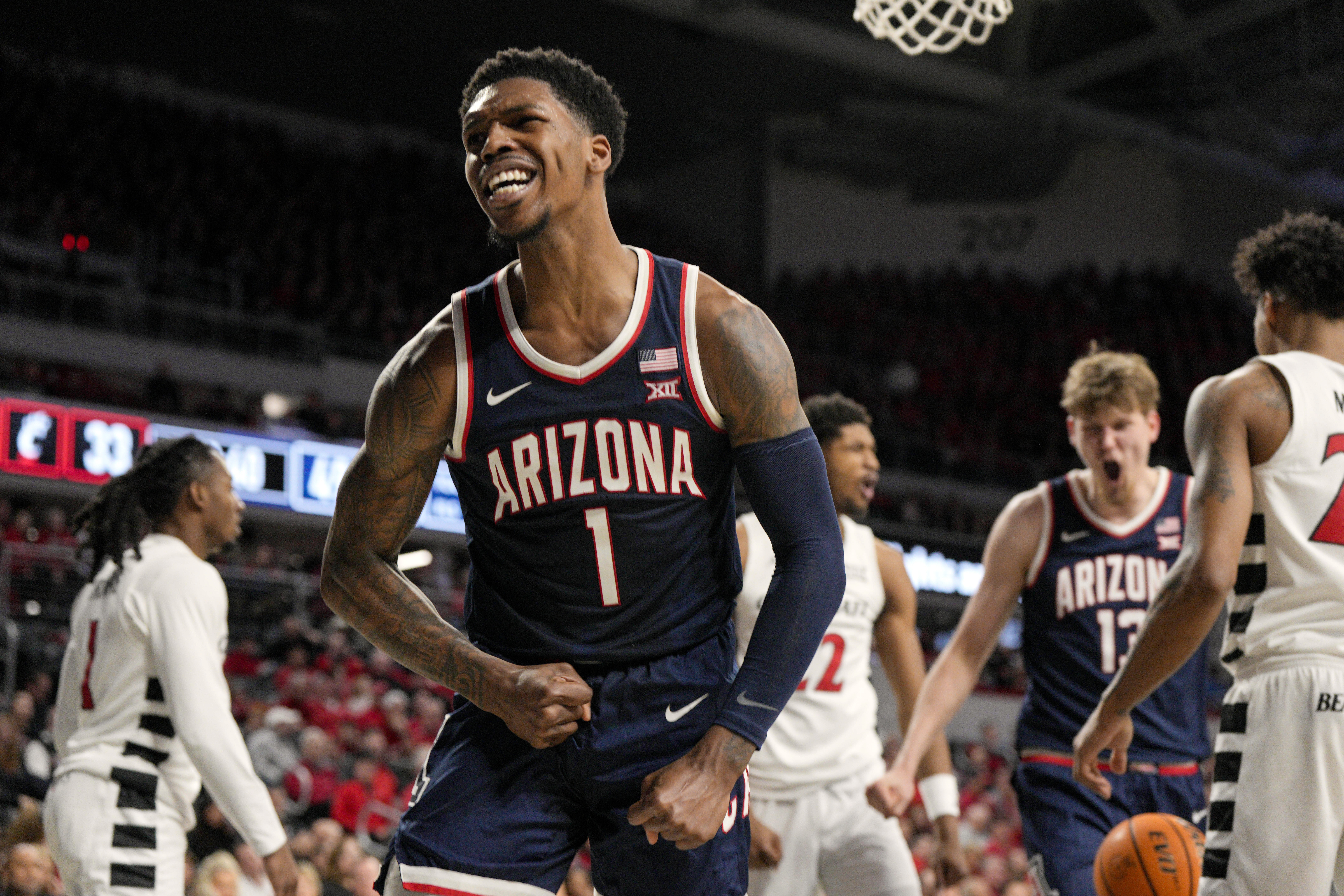Arizona guard Caleb Love (1) reacts after scoring during an NCAA college basketball game against Cincinnati, Saturday, Jan. 4, 2025, in Cincinnati.