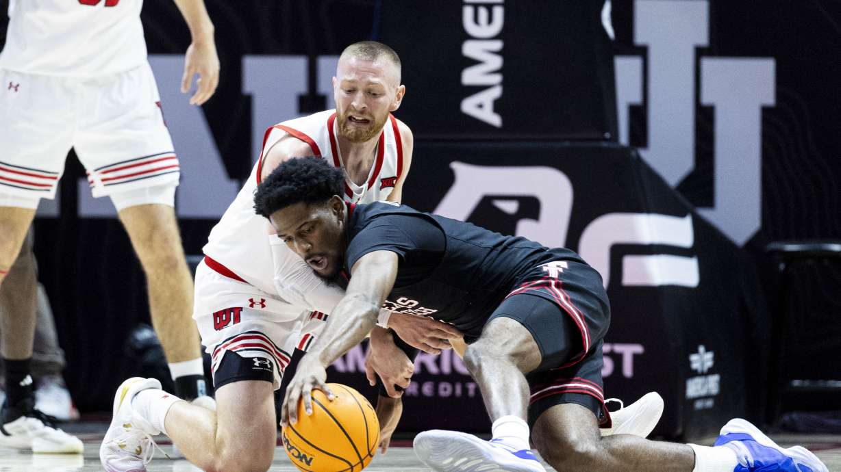Utah Utes guard Mason Madsen (45) and Texas Tech Red Raiders guard Kevin Overton (1) compete for possession of a loose ball during an NCAA men’s basketball game held at the Jon M. Huntsman Center in Salt Lake City on Saturday, Jan. 4, 2025.