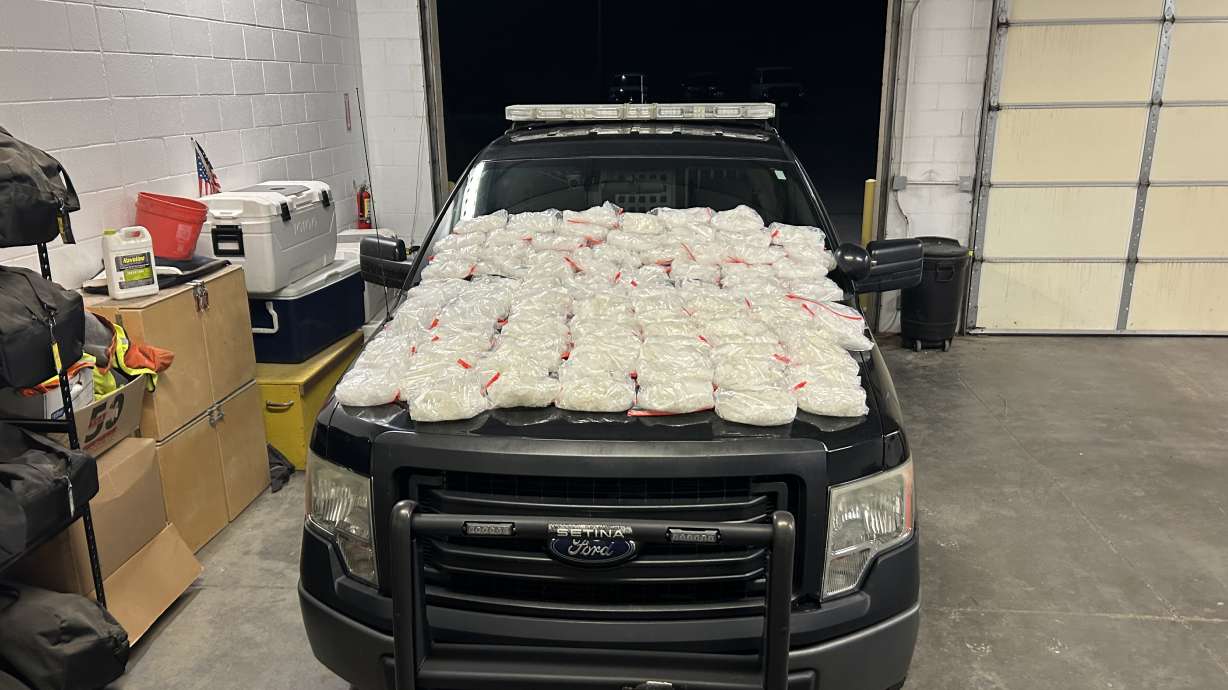 The hood of the Nephi Police Department's patrol car is covered by over 100 pounds of meth in plastic bags. The meth was discovered in a vehicle traveling through Utah on Friday.