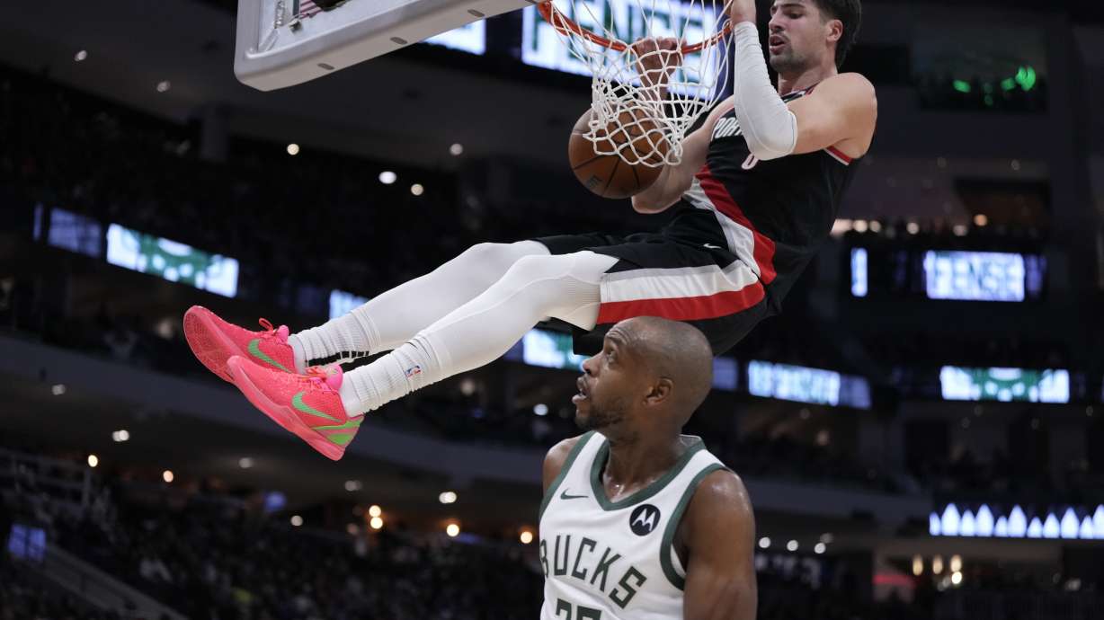 Milwaukee Bucks' Khris Middleton watches Portland Trail Blazers' Deni Avdija dunk during the second half of an NBA basketball game Saturday, Jan. 4, 2025, in Milwaukee.