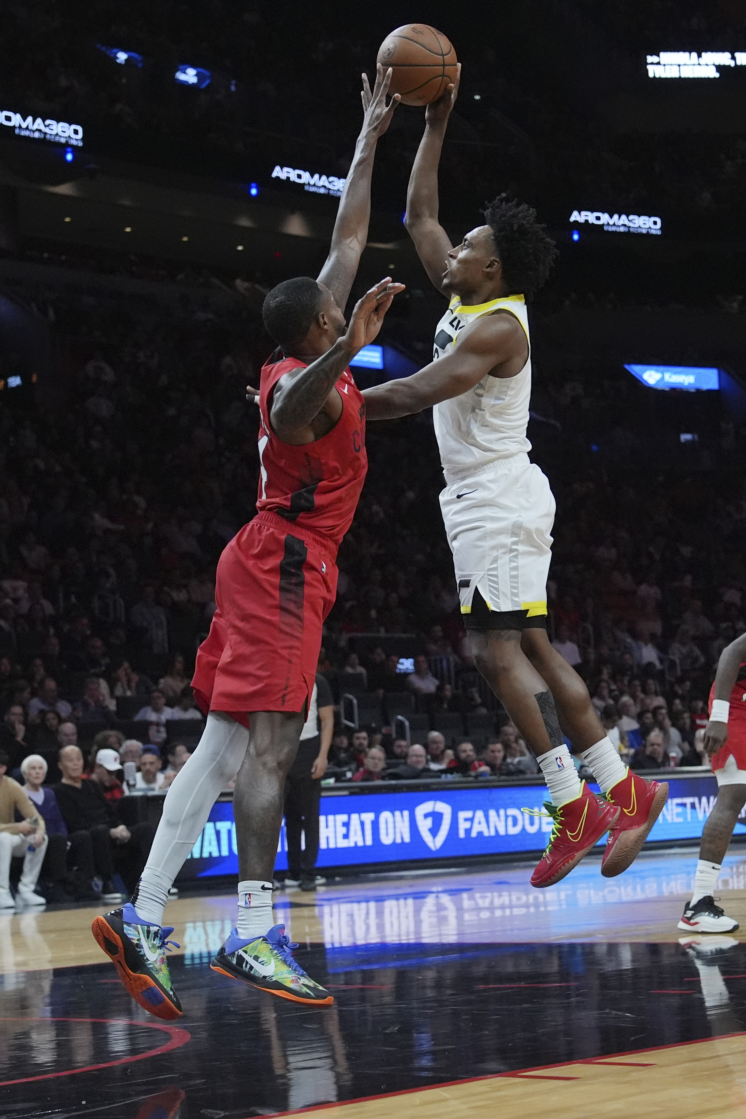 Utah Jazz forward Brice Sensabaugh, right, shoots as Miami Heat forward Haywood Highsmith, left, defends during the second half of an NBA basketball game Saturday, Jan. 4, 2025, in Miami.