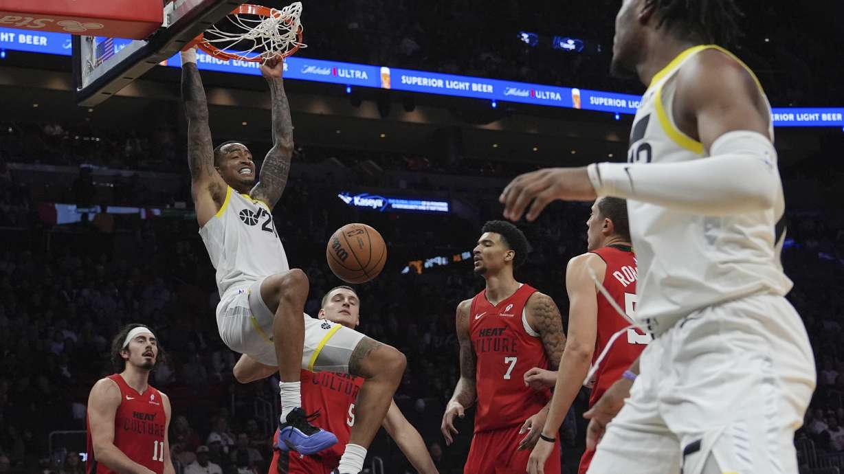 Utah Jazz forward John Collins (20) dunks during the second half of an NBA basketball game against the Miami Heat, Saturday, Jan. 4, 2025, in Miami.