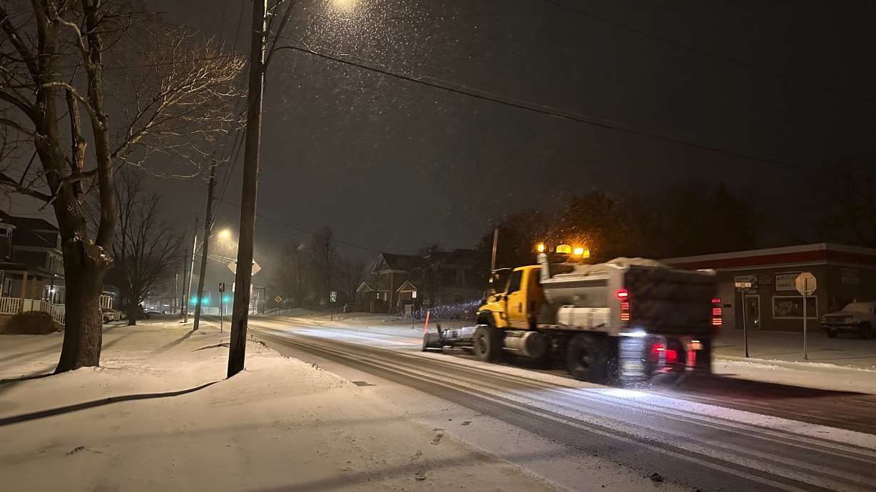 A snowplow passes through Lowville, New York, on Saturday. A major, disruptive winter storm was sweeping across the central U.S. and headed toward the mid-Atlantic on Sunday.