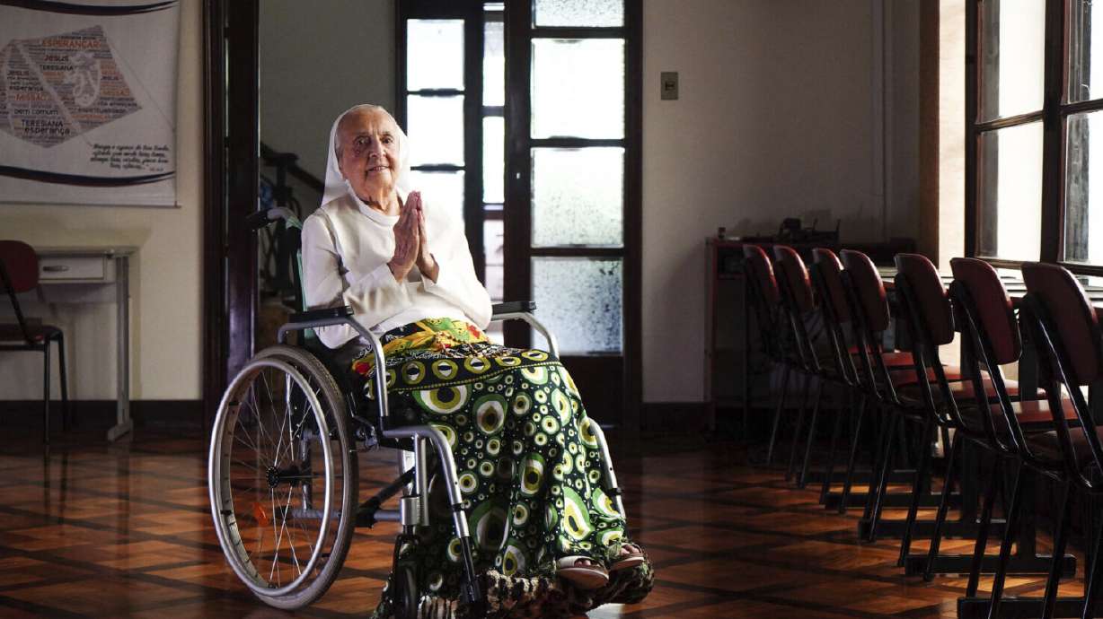 Sister Inah Canabarro puts her hands together in prayer, in Porto Alegre, Brazil, Feb. 16, 2024. The soccer-loving nun from Brazil is believed to have become the world's oldest living person at nearly age 117.