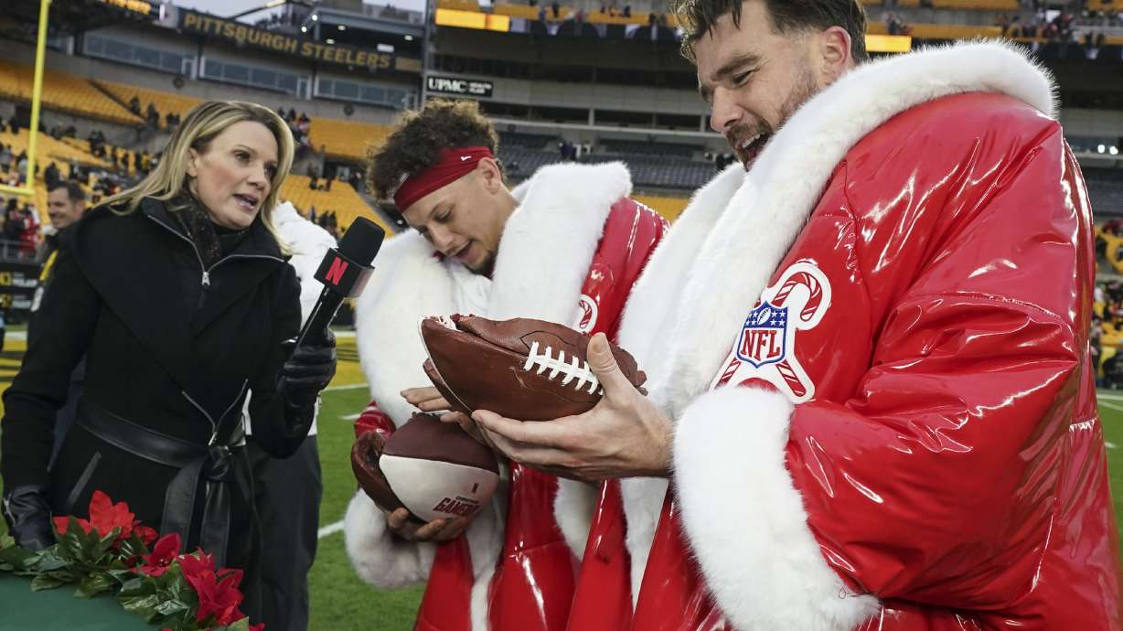 Kansas City Chiefs quarterback Patrick Mahomes and Travis Kelce speak after an NFL football game against the Pittsburgh Steelers, Wednesday, Dec. 25, 2024, in Pittsburgh.