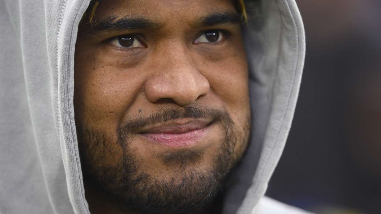 Miami Dolphins quarterback Tua Tagovailoa stands on the field before an NFL football game against the Cleveland Browns Sunday, Dec. 29, 2024, in Cleveland.