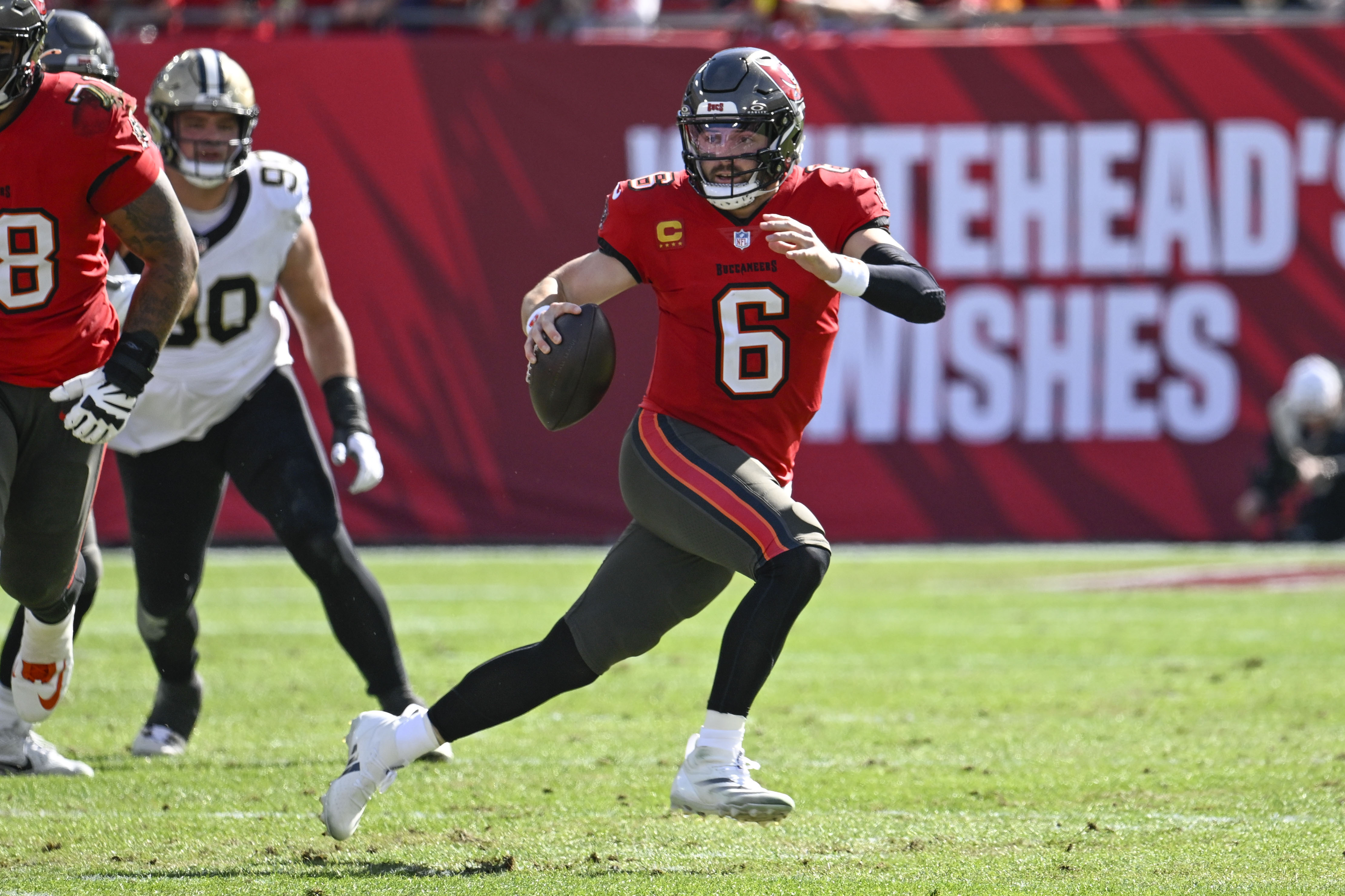 Buccaneers beat Saints 27-19 to clinch NFC South and wide receiver Mike Evans surpasses 1,000 yards