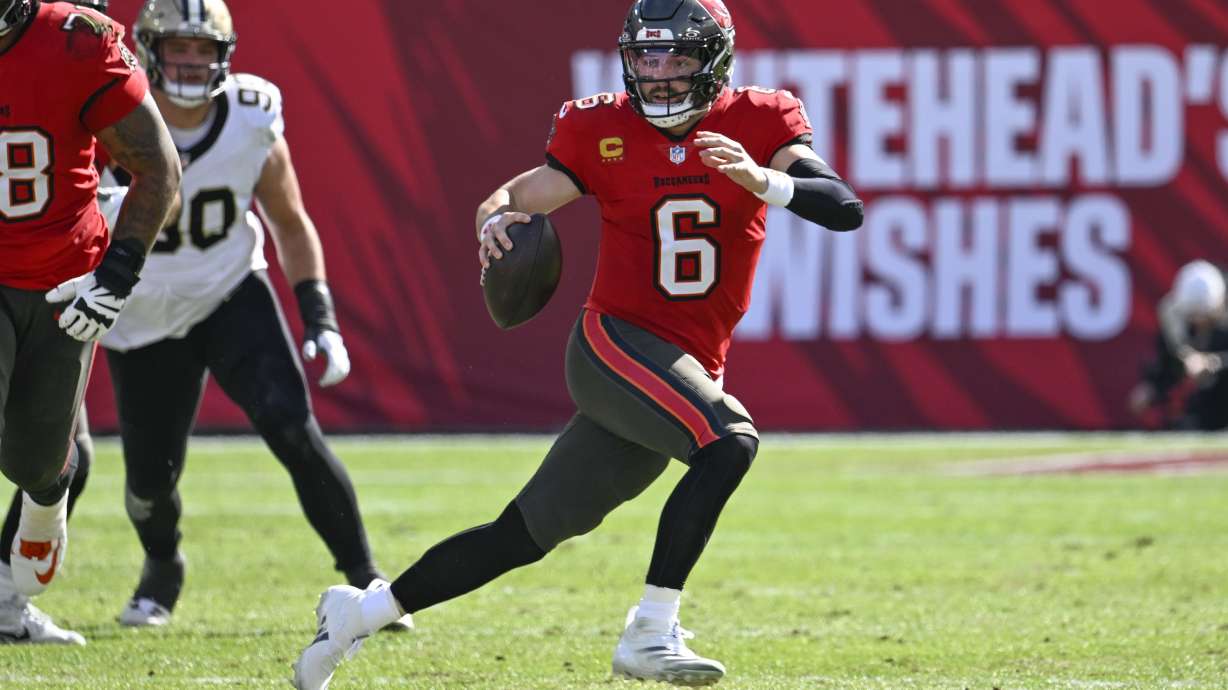 Tampa Bay Buccaneers quarterback Baker Mayfield (6) scrambles during the first half of an NFL football game against the New Orleans Saints Sunday, Jan. 5, 2025, in Tampa, Fla.