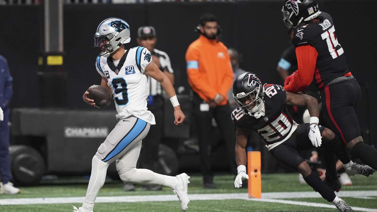 Carolina Panthers quarterback Bryce Young scores against the Atlanta Falcons during the second half of an NFL football game, Sunday, Jan. 5, 2025, in Atlanta.