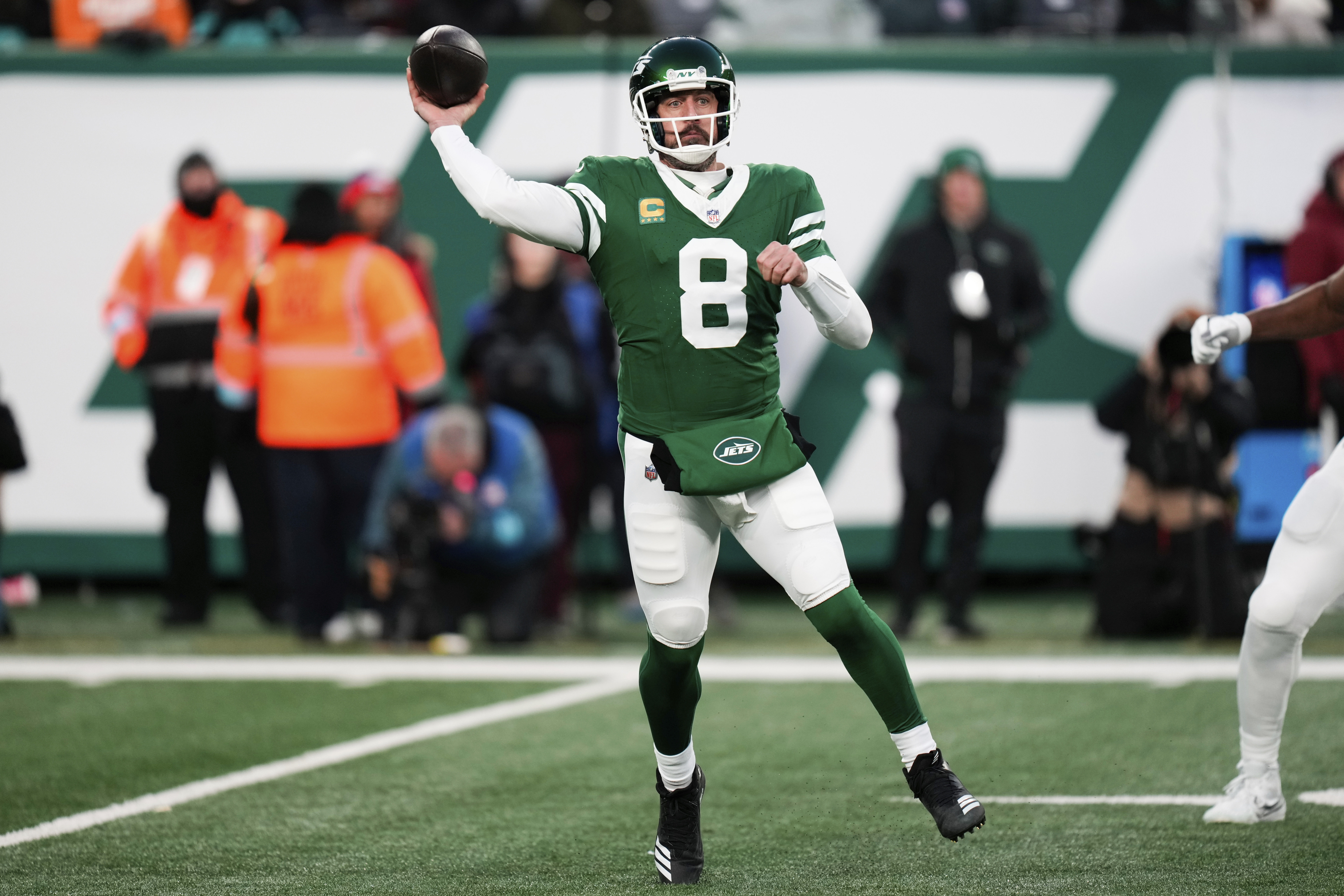 New York Jets quarterback Aaron Rodgers (8) throws during the first half of an NFL football game against the Miami Dolphins, Sunday, Jan. 5, 2025, in East Rutherford, N.J.