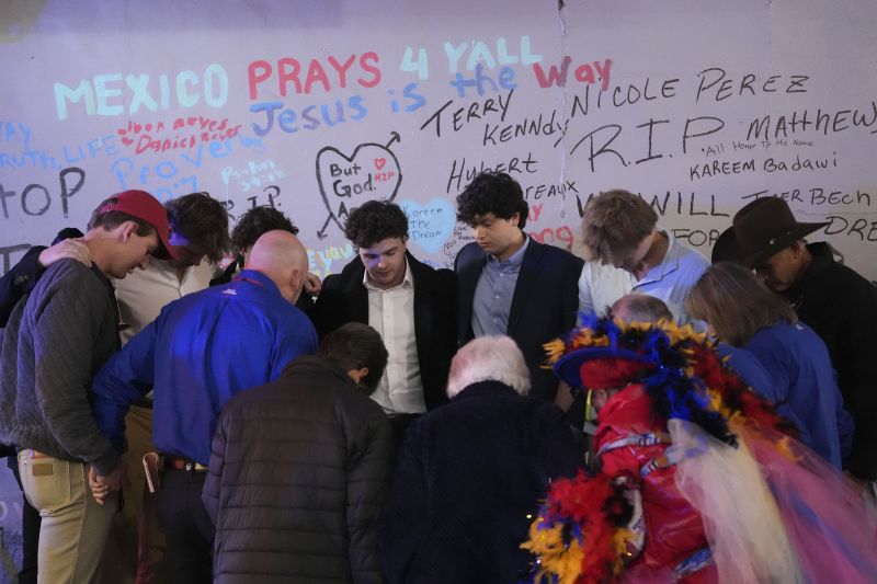 Friends of Kareem Badawi, a victim of the deadly truck attack on New Year's Day in New Orleans, pray at a memorial for victims after attending his funeral, Friday.