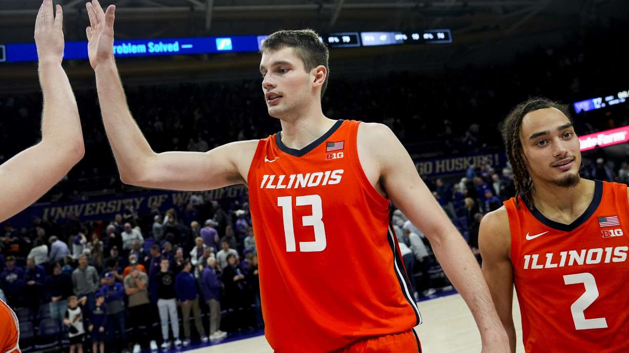 Illinois center Tomislav Ivisic (13) reacts with guard Dra Gibbs-Lawhorn (2) while celebrating an 81-77 win against Washington in an NCAA college basketball game Sunday, Jan. 5, 2025, in Seattle.
