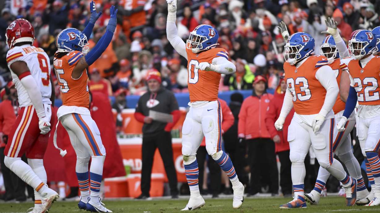 Denver Broncos outside linebacker Jonathon Cooper (0) celebrates after sacking Kansas City Chiefs quarterback Carson Wentz during the first half of an NFL football game Sunday, Jan. 5, 2025, in Denver.