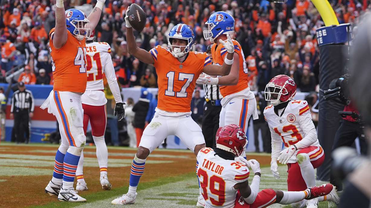 Denver Broncos wide receiver Devaughn Vele (17) celebrates after catching a touchdown pass during the first half of an NFL football game against the Kansas City Chiefs Sunday, Jan. 5, 2025, in Denver.