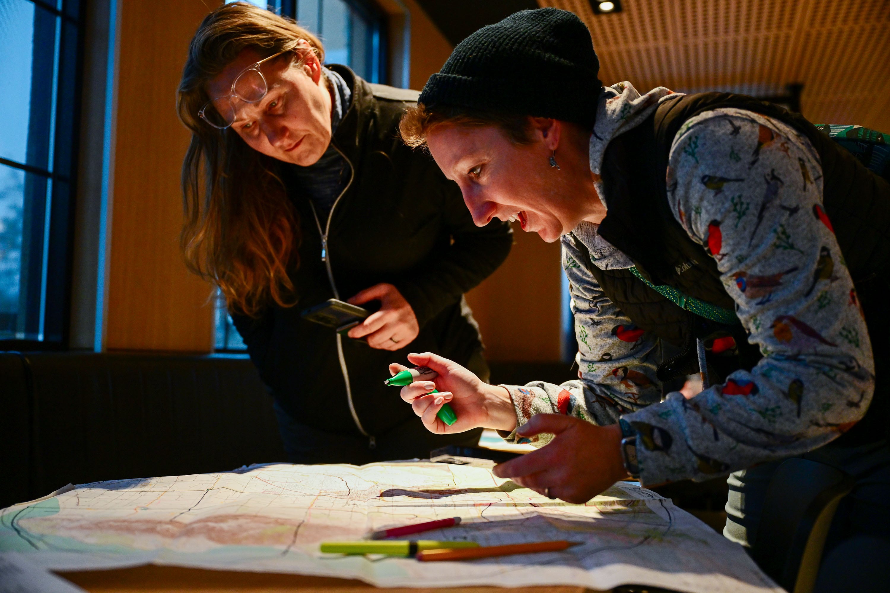 Connie Misket and Keeli Marvel look at a map as they and several eager bird-watchers gather at a McDonald's in Payson to participate in the annual Christmas Bird Count on Dec. 28, 2024.