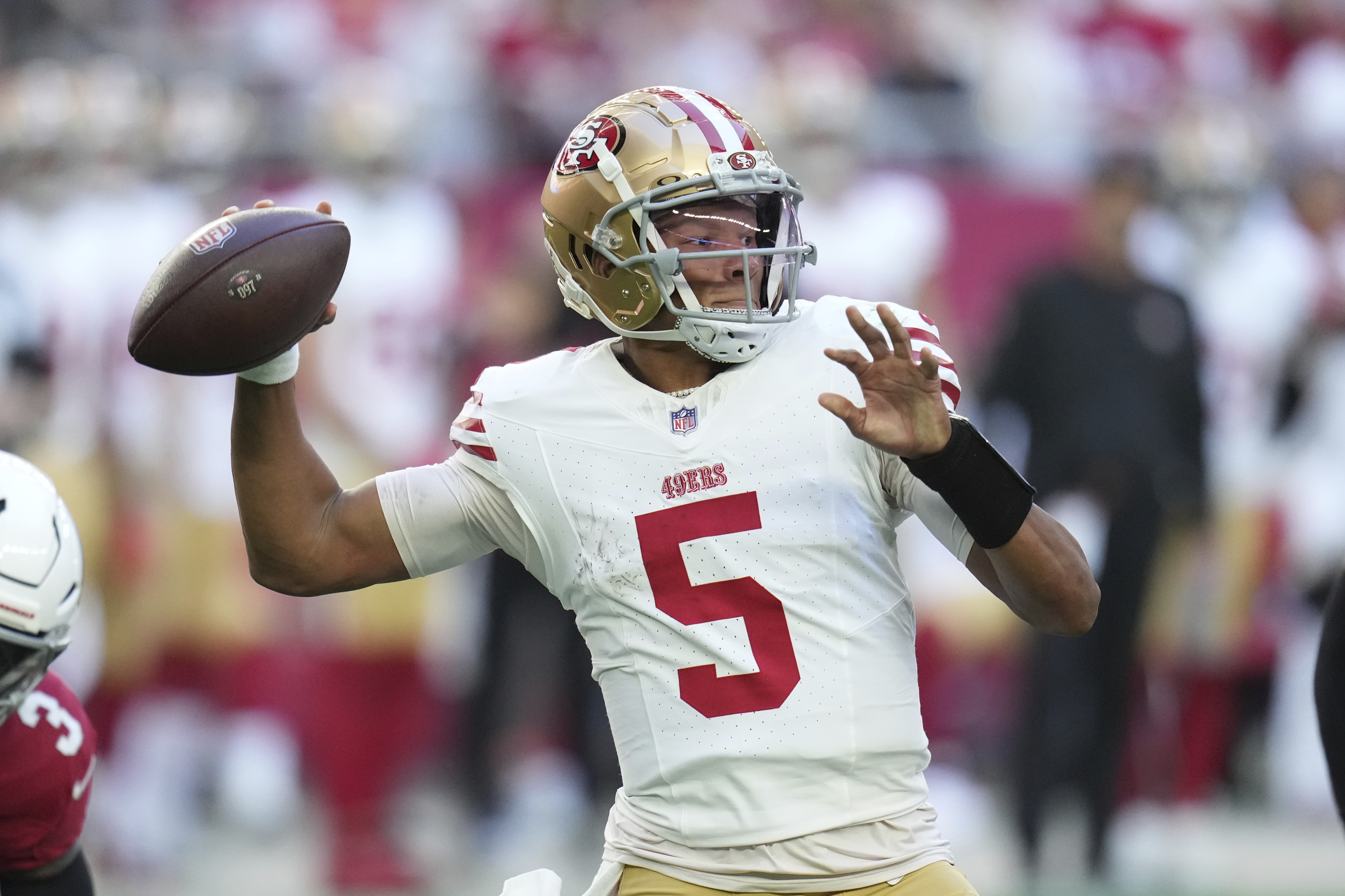 San Francisco 49ers quarterback Joshua Dobbs (5) looks to pass against the Arizona Cardinals during the first half of an NFL football game in Glendale, Ariz., Sunday, Jan. 5, 2025. 