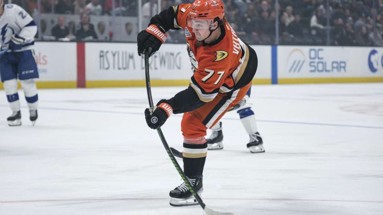 Anaheim Ducks right wing Frank Vatrano (77) shoots the puck during the first period of an NHL hockey game against the Tampa Bay Lightning, Sunday, Jan. 5, 2025, in Anaheim, Calif.