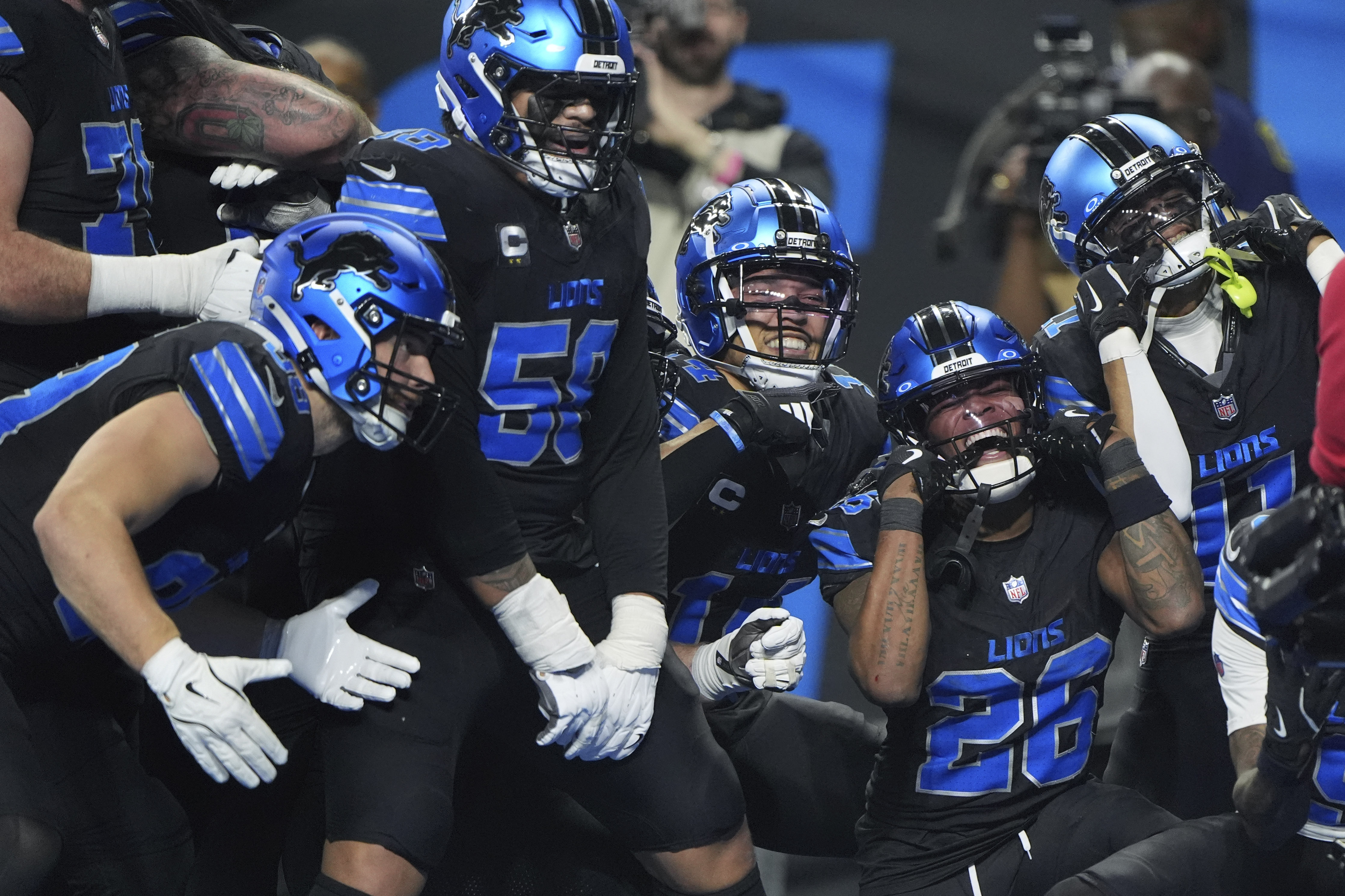 Detroit Lions running back Jahmyr Gibbs (26) celebrates with teammates after he ran for a touchdown against the Minnesota Vikings during the second half of an NFL football game Sunday, Jan. 5, 2025, in Detroit. 