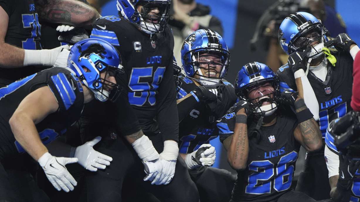 Detroit Lions running back Jahmyr Gibbs (26) celebrates with teammates after he ran for a touchdown against the Minnesota Vikings during the second half of an NFL football game Sunday, Jan. 5, 2025, in Detroit.