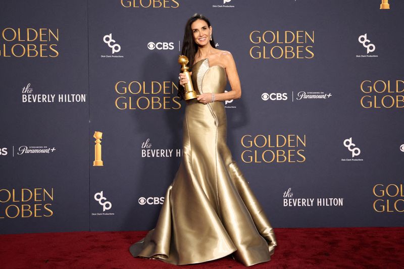 Demi Moore poses with the award for Best Performance by an Actress in a Motion Picture — Musical or Comedy, for The Substance, at the 82nd Golden Globe Awards in Beverly Hills, Calif.