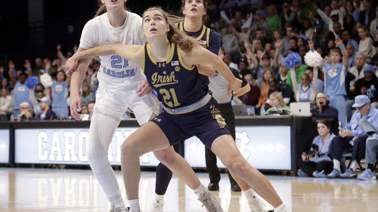 Notre Dame forward Maddy Westbeld, right, boxes out North Carolina forward Ciera Toomey, left, during the first half of an NCAA college basketball game Sunday, Jan. 5, 2025, in Chapel Hill, N.C.
