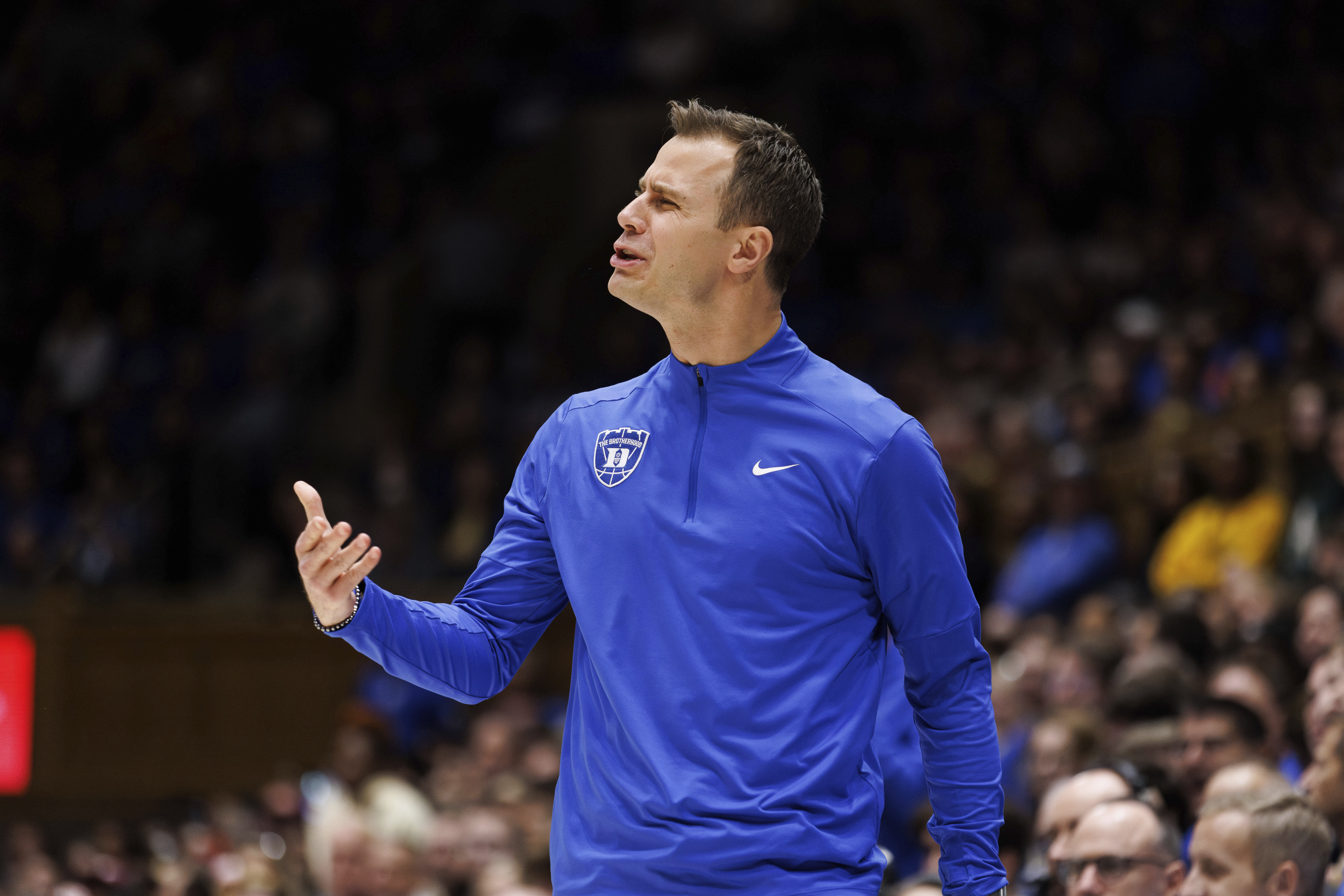 Duke head coach Jon Scheyer reacts to a play during the first half of an NCAA college basketball game against Virginia Tech in Durham, N.C., Tuesday, Dec. 31, 2024.