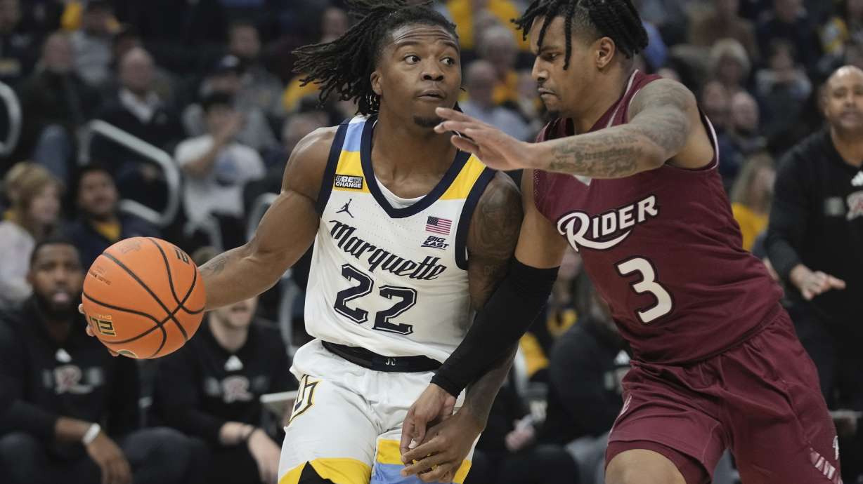 FILE - Marquette's Sean Jones tries to get past Rider's Corey McKeithan during the first half of an NCAA college basketball game Friday, Nov. 10, 2023, in Milwaukee.
