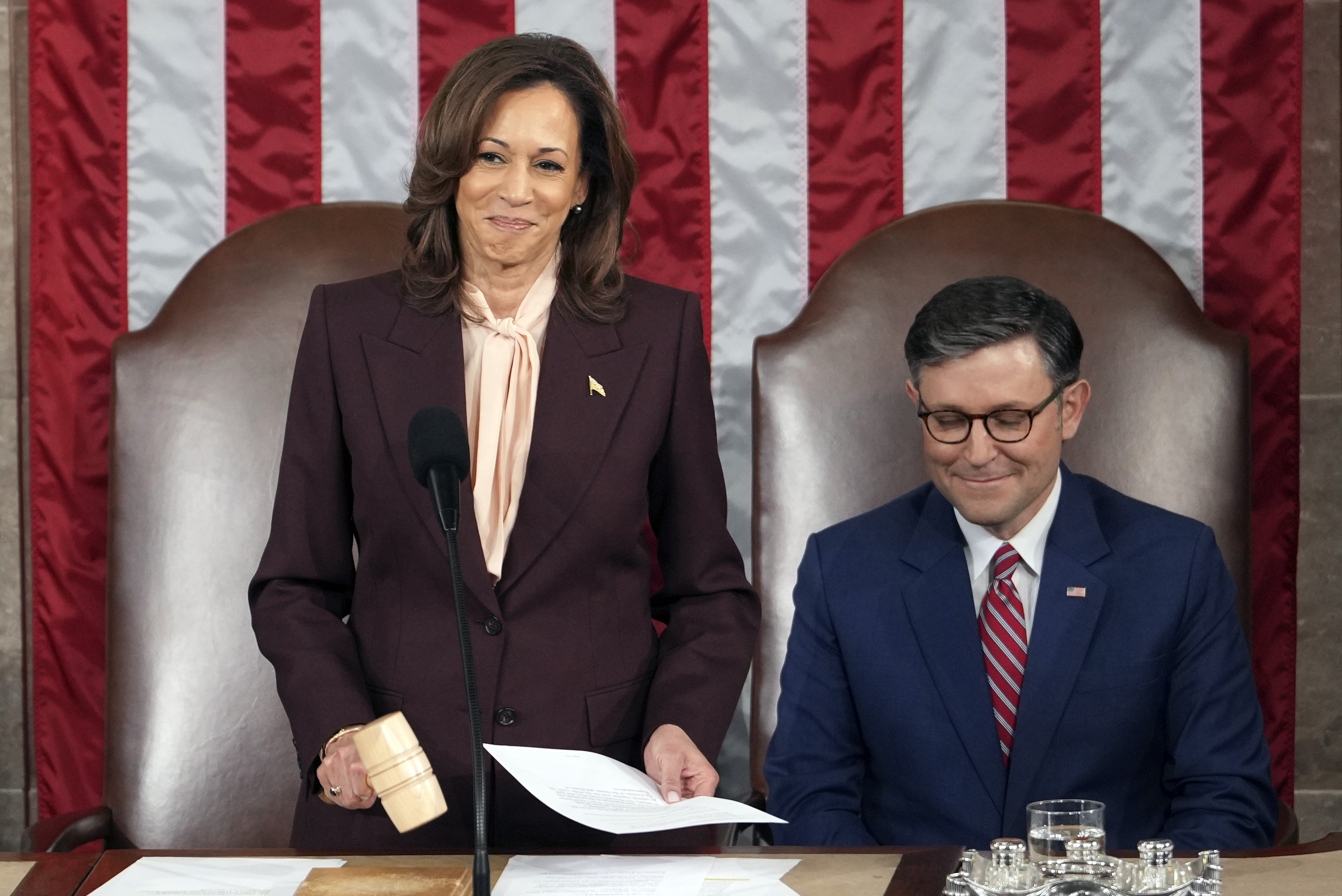Vice President Kamala Harris reads the results as House Speaker Mike Johnson of La., listens during a joint session of Congress to confirm the Electoral College votes, affirming President-elect Donald Trump's victory in the presidential election, Monday, at the U.S. Capitol in Washington.