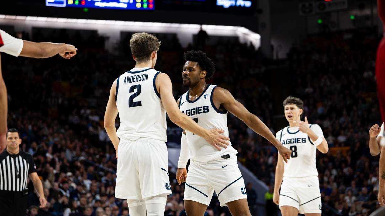 Utah State players react to making a shot.