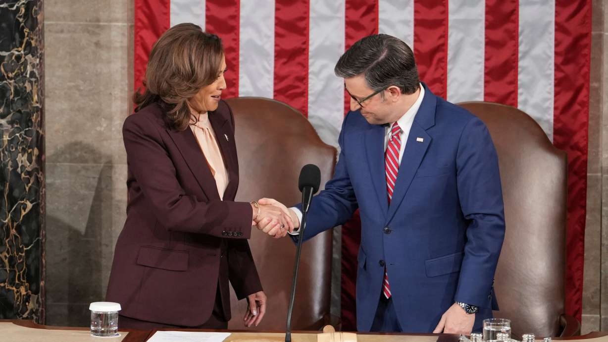 Vice President Kamala Harris shakes hands with House Speaker Mike Johnson, R-La., as a joint session of Congress convenes to confirm the Electoral College votes, Monday at the U.S. Capitol in Washington.