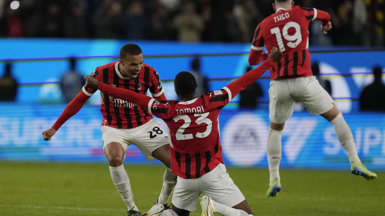 AC Milan's Fikayo Tomori, center, celebrates with teammates after winning the Italian Super Cup final soccer match between AC Milan and Inter Milan at Al Awwal Park Stadium in Riyadh, Saudi Arabia, Monday, Jan. 6, 2025.