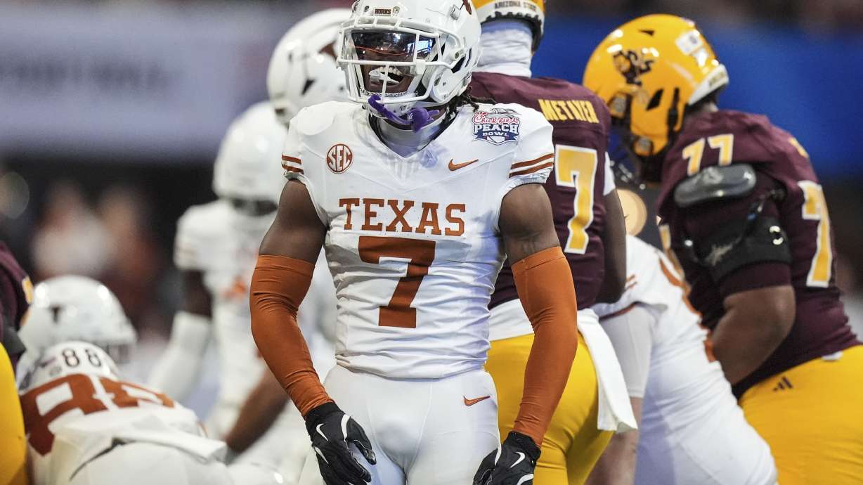 Texas defensive back Jahdae Barron (7) celebrates a defensive play against Arizona State during the first half in the quarterfinals of a College Football Playoff, Wednesday, Jan. 1, 2025, in Atlanta.