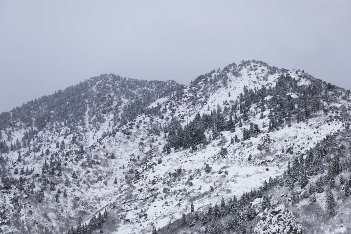 Snow-covered mountains seen from the entrance to Big Cottonwood Canyon on Saturday. Hydrologists caution even areas with moisture the last few weeks could deal with less-efficient snowmelt in the spring because of poor soil conditions before this year's snowpack collection.