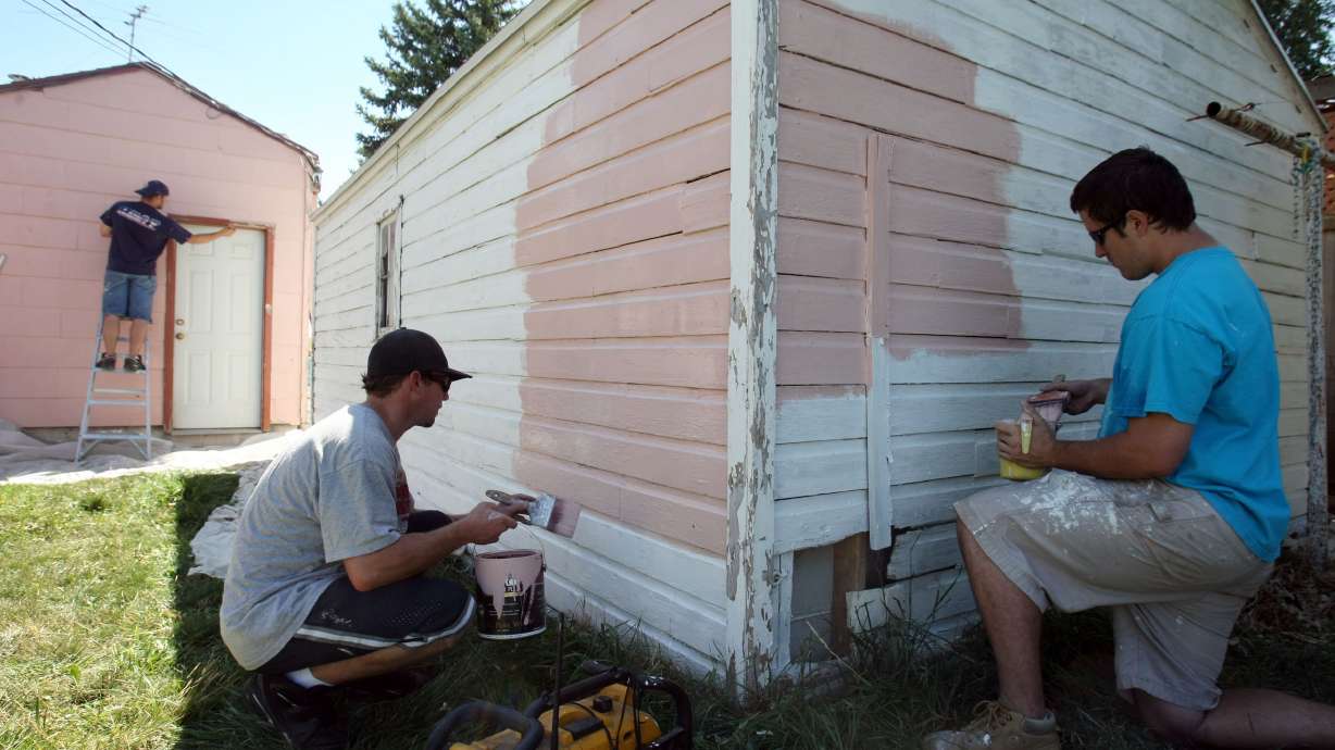 M&B Construction workers repaint a home in Salt Lake City on Aug. 17, 2010, after lead-based paint was discovered. Salt Lake County received funding from the federal government for lead paint removal and other home health hazards.