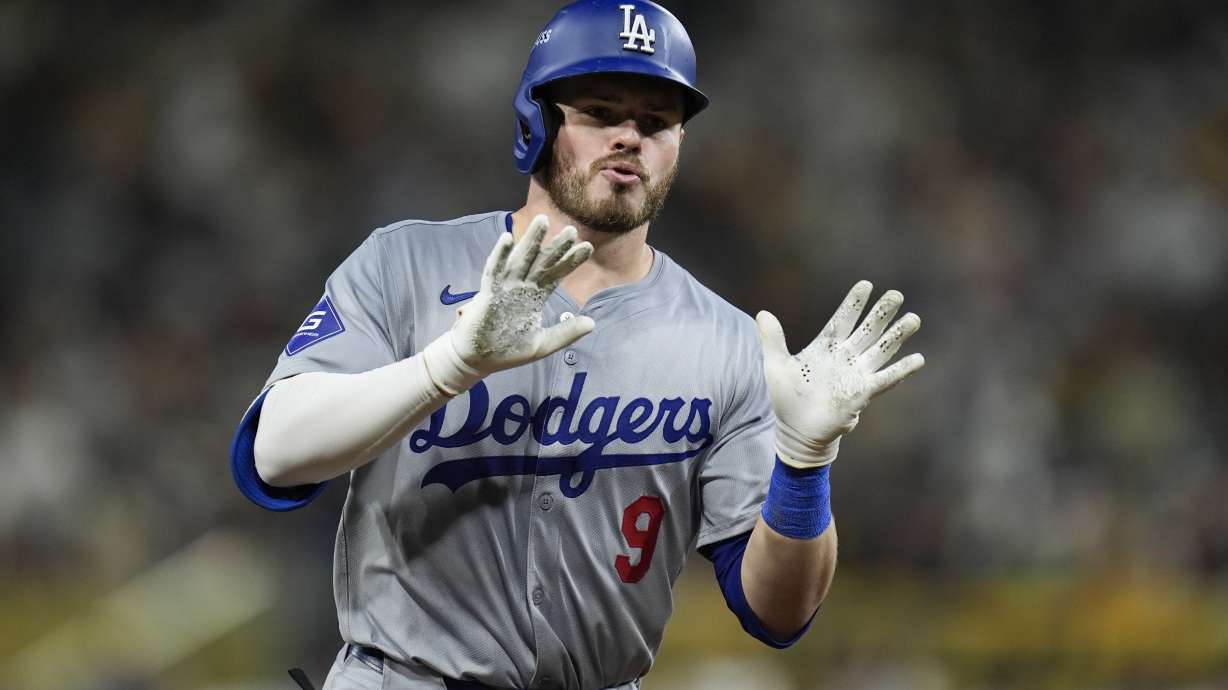 FILE - Los Angeles Dodgers' Gavin Lux celebrates as he rounds the bases after his two-run home run during the seventh inning in Game 4 of a baseball NL Division Series against the San Diego Padres, Wednesday, Oct. 9, 2024, in San Diego.