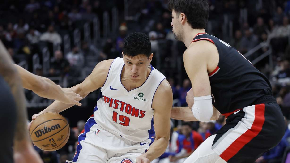 Detroit Pistons forward Simone Fontecchio (19) drives the lane against Portland Trail Blazers forward Deni Avdija, right, during the first half of an NBA basketball game, Monday, Jan. 6, 2025, in Detroit.