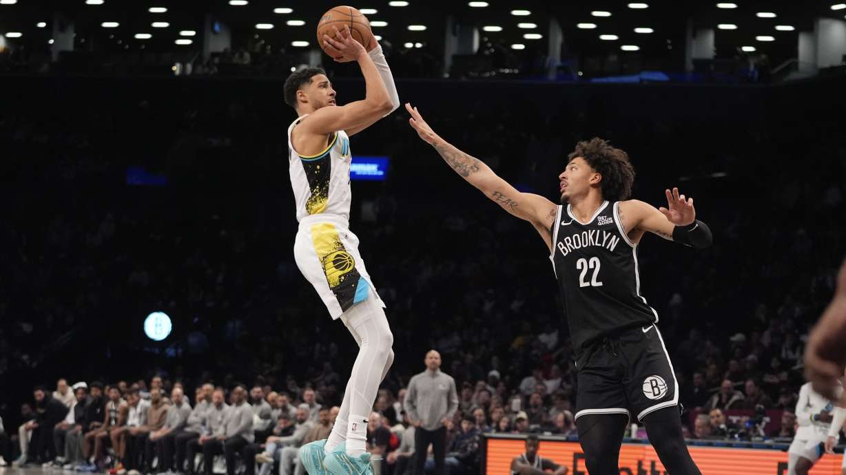 Indiana Pacers' Tyrese Haliburton, left, shoots over Brooklyn Nets' Jalen Wilson (22) during the second half of an NBA basketball game, Monday, Jan. 6, 2025, in New York.