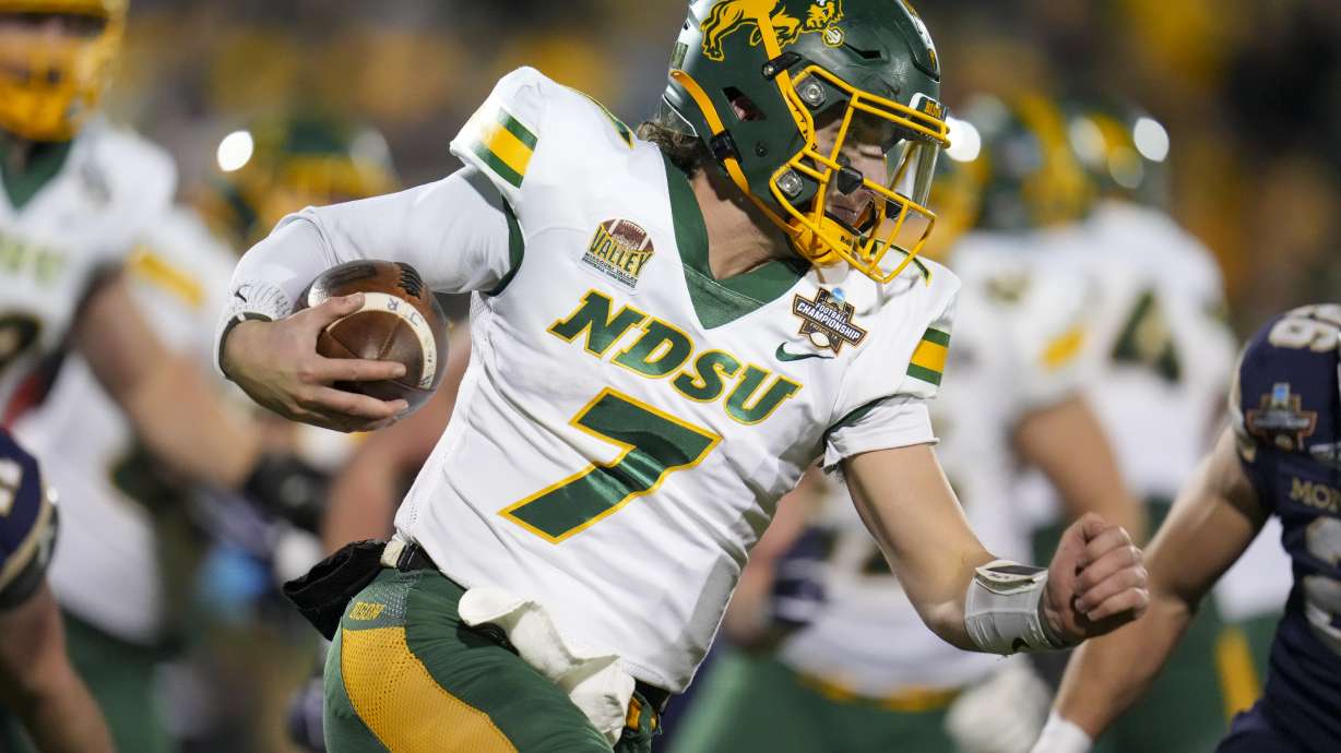 North Dakota State quarterback Cam Miller runs with the ball against Montana State during the first half of the FCS Championship NCAA college football game, Monday, Jan. 6, 2025, in Frisco, Texas.