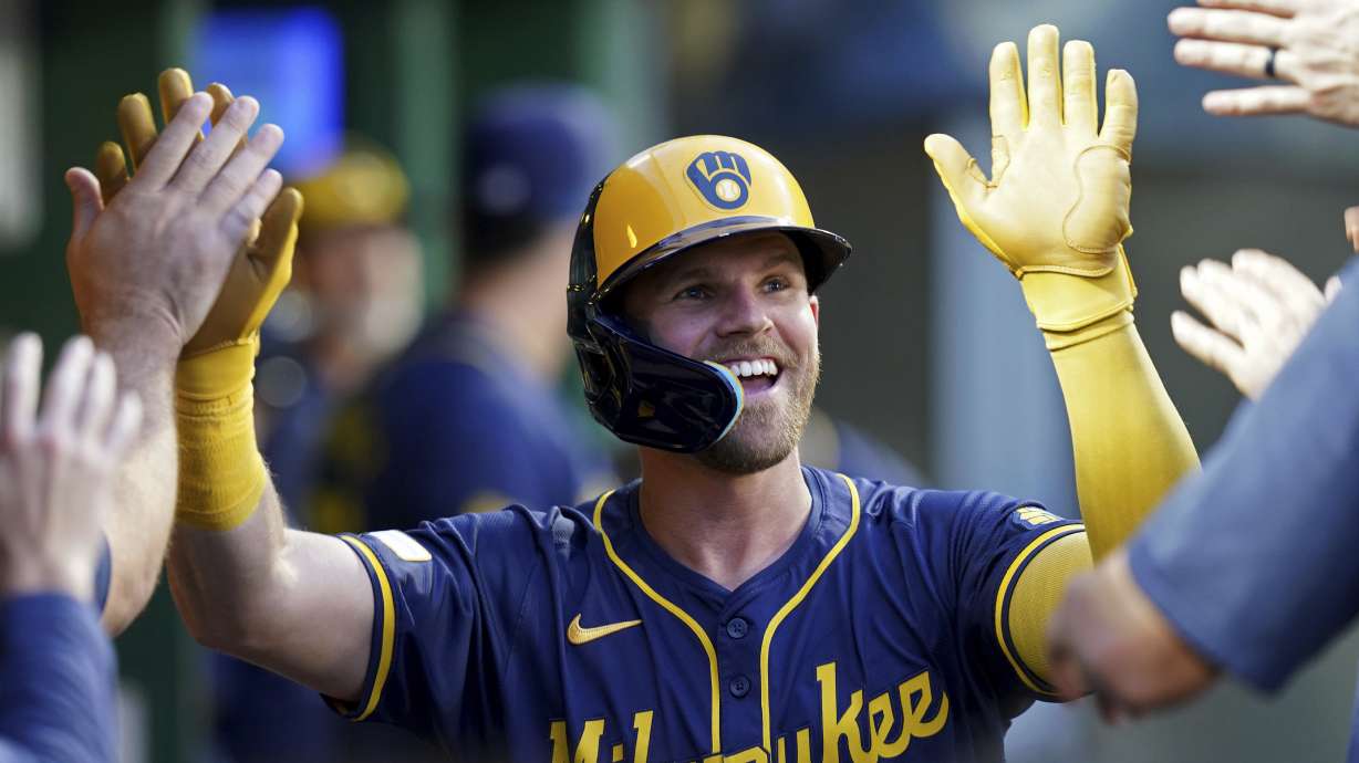 FILE - Milwaukee Brewers' Jake Bauers celebrates in the dugout after hitting a home run during the second inning of a baseball game against the Pittsburgh Pirates, Sept. 25, 2024, in Pittsburgh.