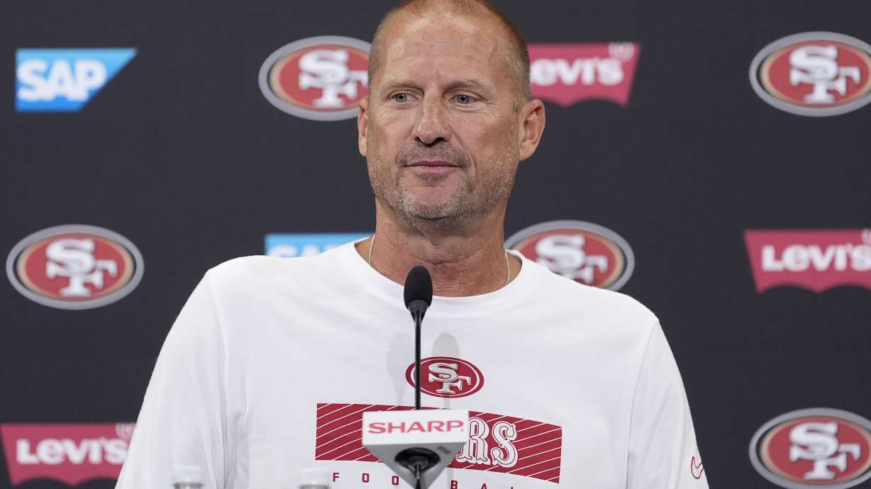 FILE - San Francisco 49ers special teams coordinator Brian Schneider speaks at a news conference during NFL football training camp in Santa Clara, Calif., July 30, 2024.