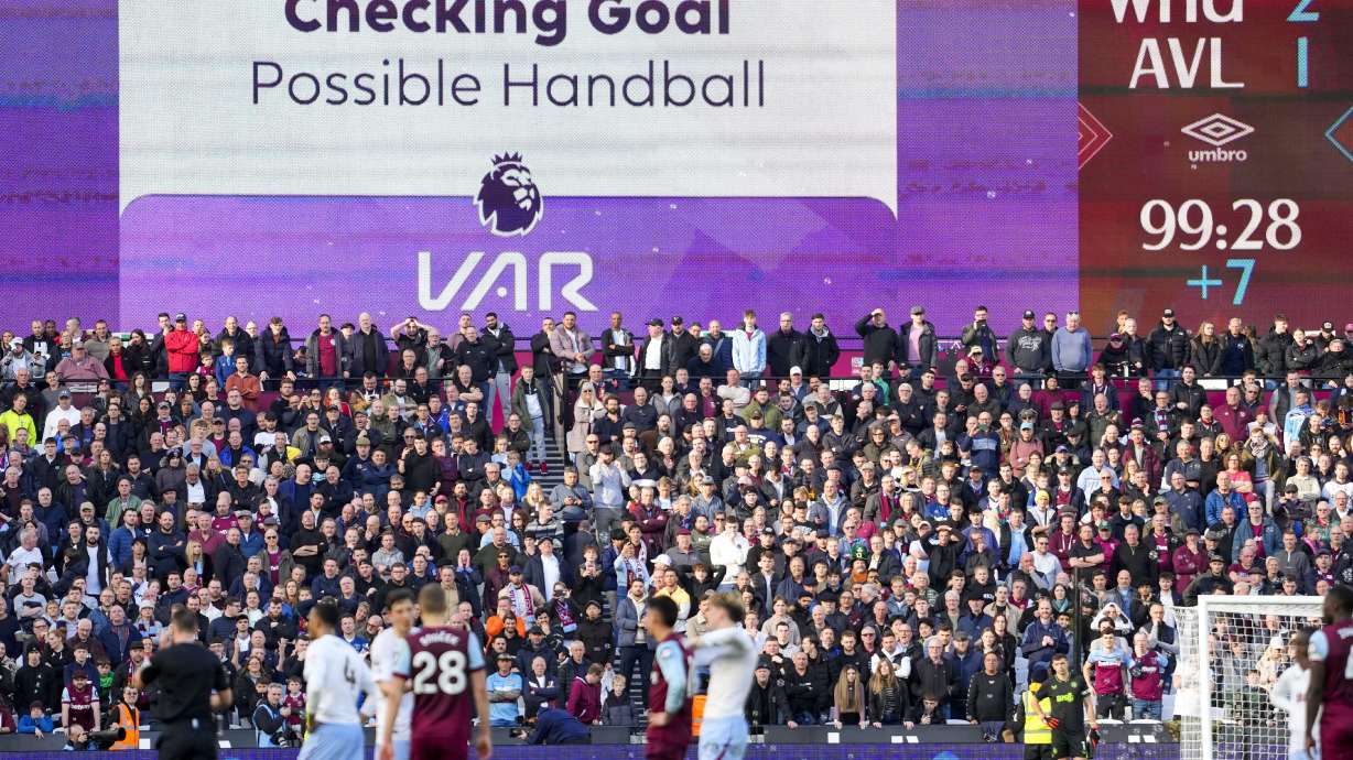 FILE - A giant screen reports a VAR review during the English Premier League soccer match between West Ham and Aston Villa, at the London stadium in London, March 17, 2024.