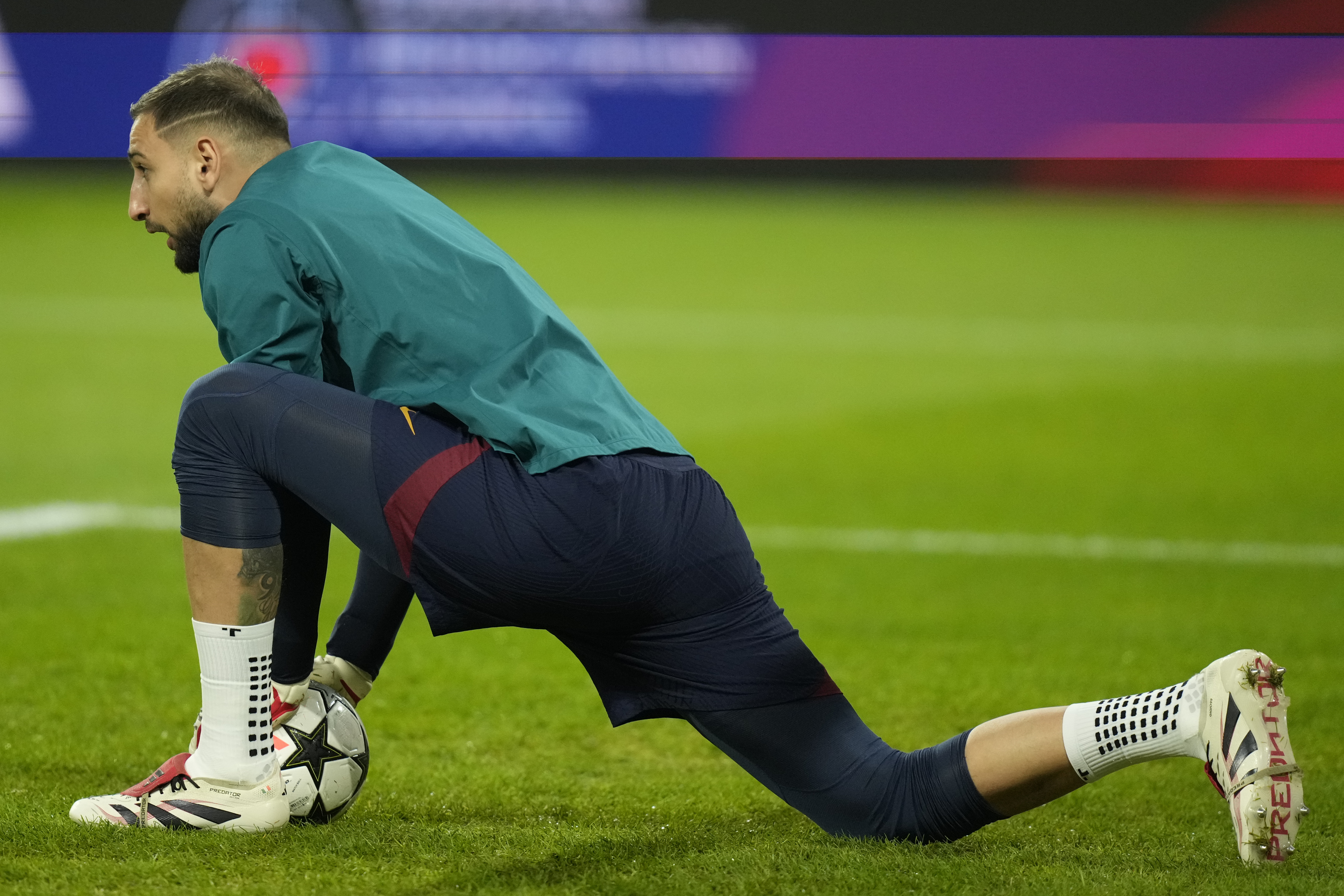 PSG's goalkeeper Gianluigi Donnarumma warms-up prior to a Champions League opening phase soccer match against FC Salzburg in Salzburg, Austria, Tuesday, Dec. 10, 2024.