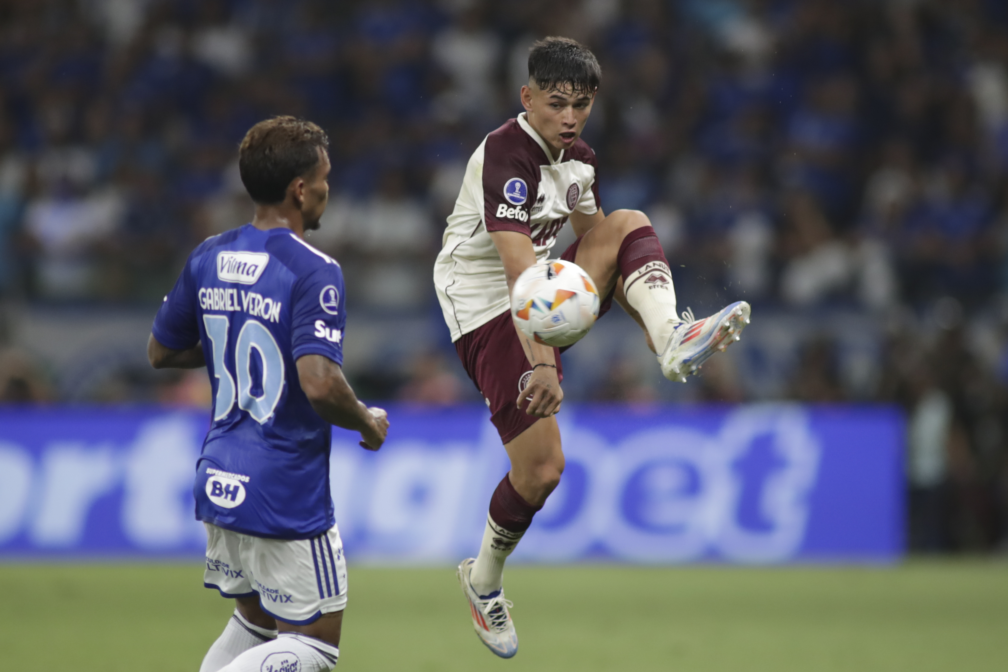 FILE - Julio Soler of Argentina's Lanus controls the ball by Gabriel Veron of Brazil's Cruzeiro during a Copa Sudamericana semifinal first leg soccer match at Mineirao stadium in Belo Horizonte, Brazil, Oct. 23, 2024.
