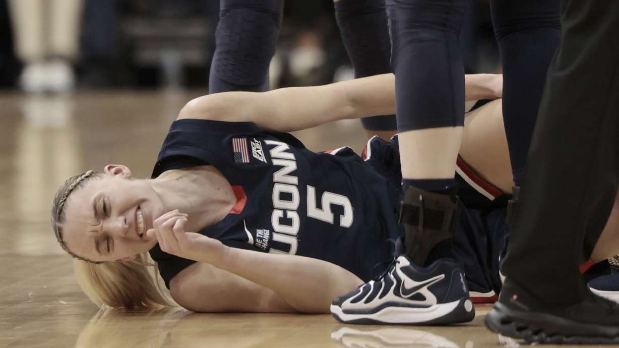 UConn's Paige Bueckers lies injured during an NCAA college basketball game against Villanova, Sunday, Jan. 5, 2025, in Villanova, Pa.